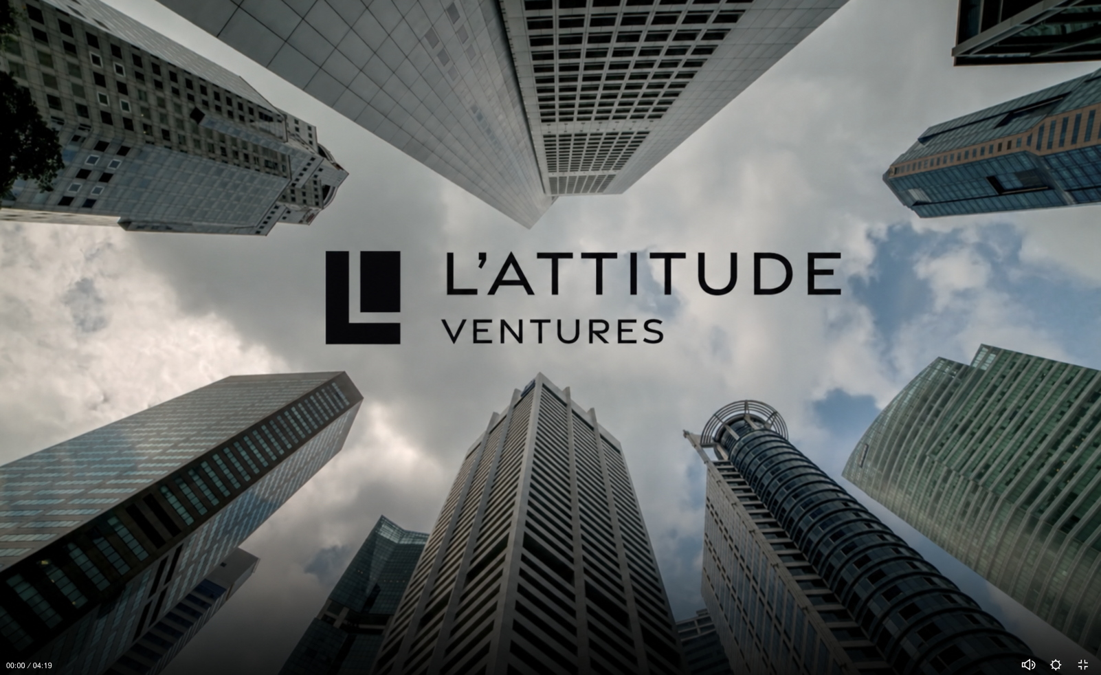 L’Attitude Ventures event recap title over an upward view of city buildings